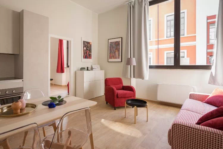 Canapé deux places dans un salon cuisine moderne