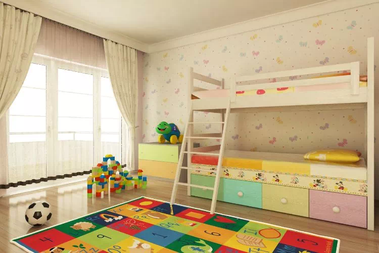 Chambre d'enfant avec un espace de jeux et des lits superposés