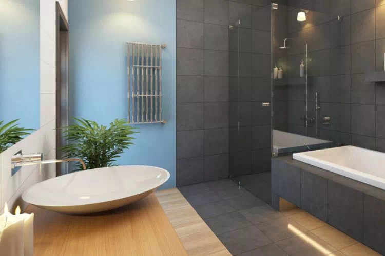 Salle de bain avec plancher en bois sous la vasque et carrelage dans la partie douche et baignoire