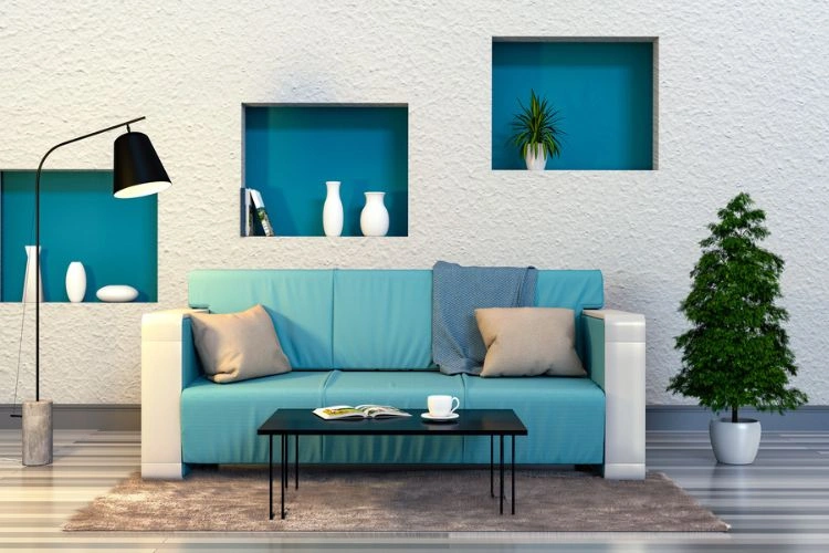 Design déco avec un mur intégré de bleu canard intense et un canapé vert canard